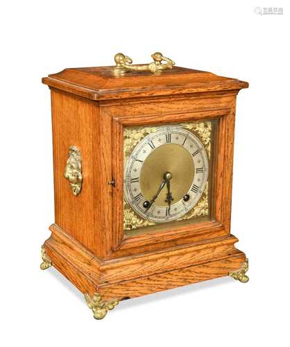 An oak case mantel clock, circa 1900,