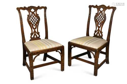 A pair of George III mahogany dining chairs, in the manner o...