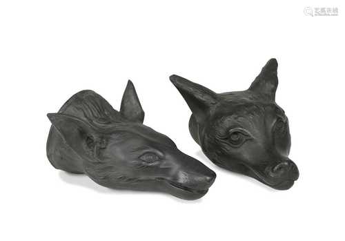 Two black basalt fox head stirrup cups, probably Wedgwood,