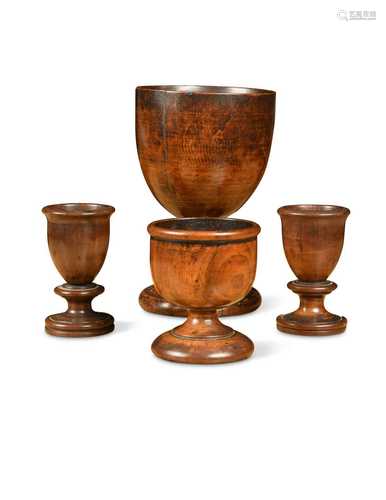 A group of four fruitwood treen cups, 18th/19th century,