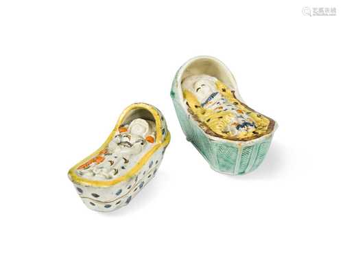 Two Prattware cradles with a sleeping child, circa 1800,