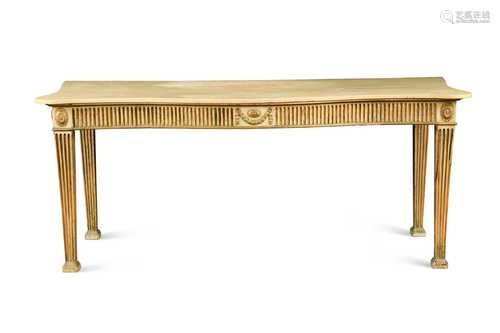 A George III serpentine serving table, in the manner of Ince...