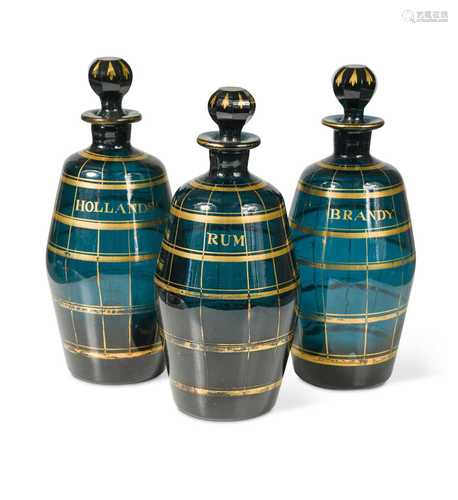 A set of three Bristol green glass decanters and stoppers, c...