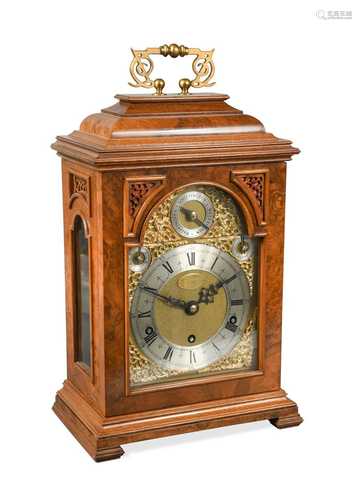 A 20th century reproduction walnut bracket clock by Elliott,...