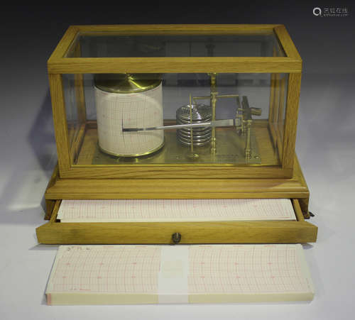 A modern pale oak cased barograph with clockwork recording d...