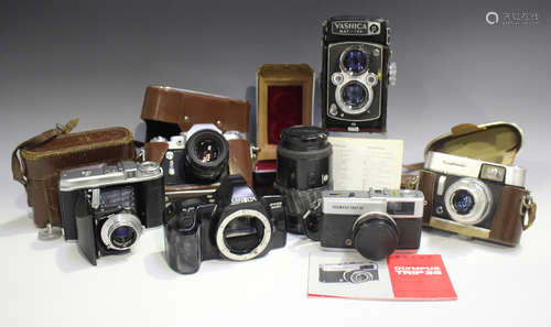 A Yashica-Mat-124 twin lens reflex camera, Serial No. 908263...