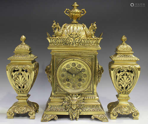 A late Victorian brass cased mantel clock with eight day mov...