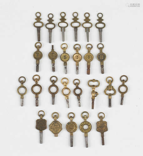 A collection of five advertising watch keys, including 'J.W....