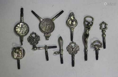 A group of ten watch keys, the terminals including the figur...