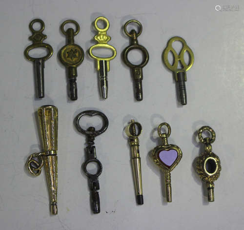 A group of five mostly Victorian watch keys, including a gol...