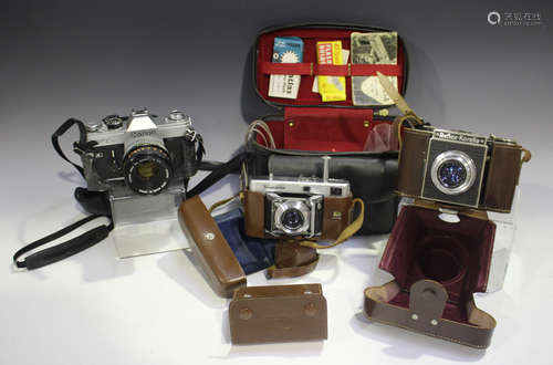 A group of cameras and accessories, including a Voigtländer ...