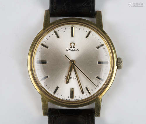 An Omega Genève gilt metal fronted and steel backed gentlema...