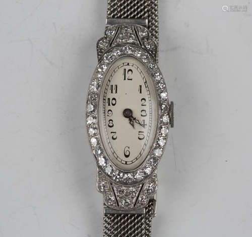 A diamond set oval cased lady's dress wristwatch with unsign...