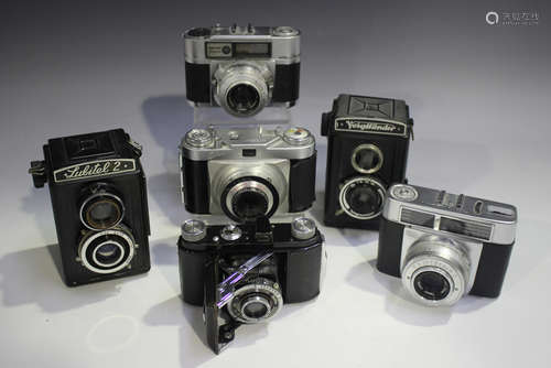 A collection of assorted cameras, including a Zeiss Ikon Con...