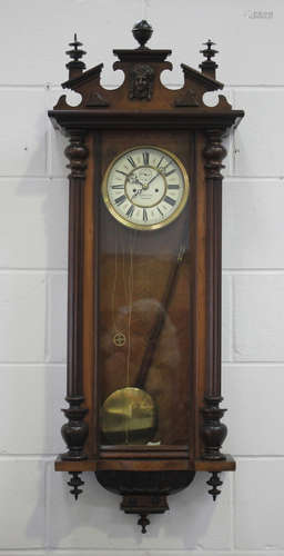 A late 19th century walnut Vienna style wall clock with eigh...