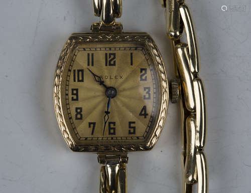 A Rolex 18ct gold tonneau cased lady's wristwatch with signe...