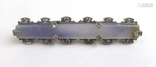 A white metal, possible jadeite and diamond bar brooch.