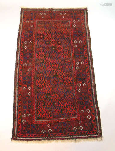 A handwoven Persian rug, the multi line border enclosing a g...