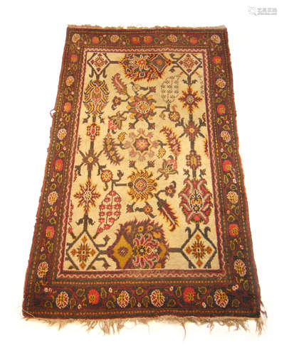 A handwoven Turkish rug, the main floral border surrounding ...