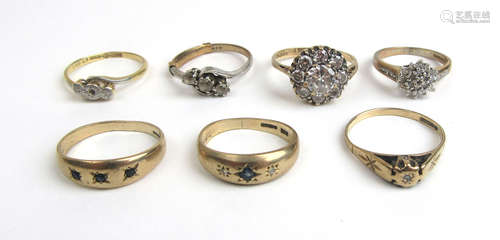 A collection of seven 9ct gold and yellow metal dress rings....