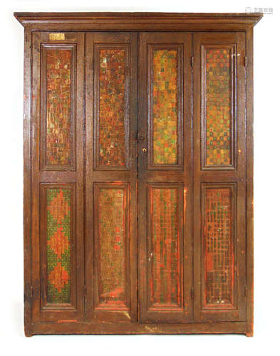 An early 20th century pine four door housekeepers cupboard w...