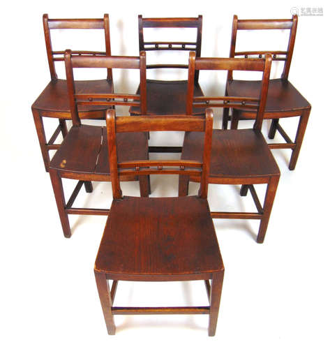 A set of five early 19th century elm and walnut dining chair...