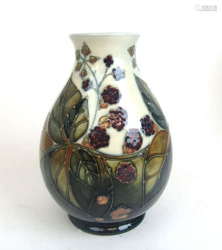 A Moorcroft ovoid vase decorated in a bramble and blackberry...