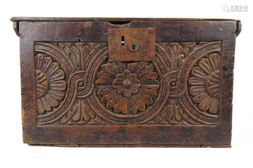 A late 17th century oak box, the top over the floral guilloc...