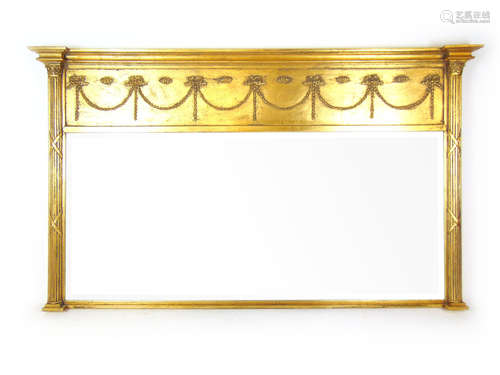 A reproduction neoclassical style giltwood over mantle mirro...