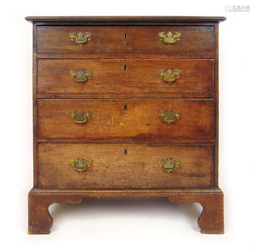 An 18th century oak chest of four long drawers on bracket fe...