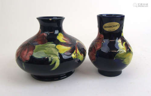 A Moorcroft 'Hibiscus' pattern vase of squat form together w...