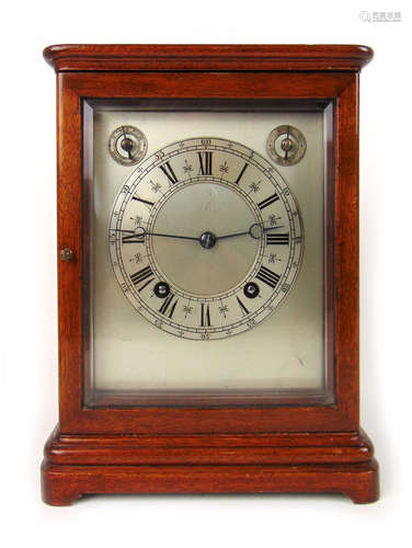 An early 20th century mahogany cased mantle clock with bevel...