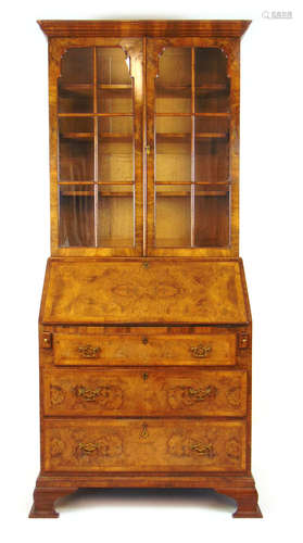 An early 20th century walnut bureau bookcase in the early 18...