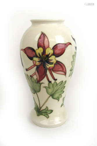 A Moorcroft 'Columbine' pattern inverted baluster vase decor...