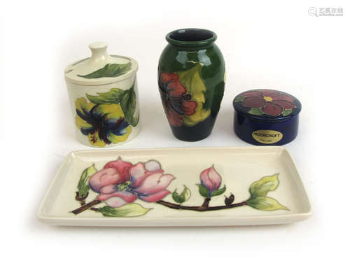 Four pieces of Moorcroft pottery comprising of a preserve po...