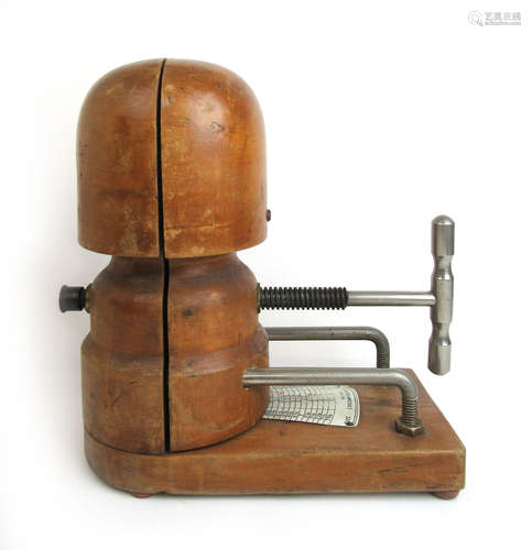 An early 20th century milliners wooden hat stretcher block, ...