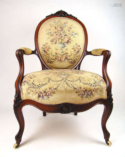 A 19th century rosewood and inlaid open arm chair upholstere...