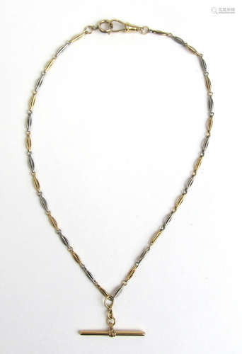 A yellow metal bi-gold t-bar necklace marked '18ct'.