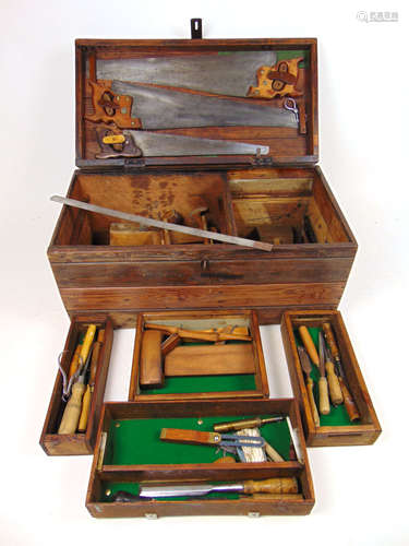 An early 20th century pine tool chest containing a selection...