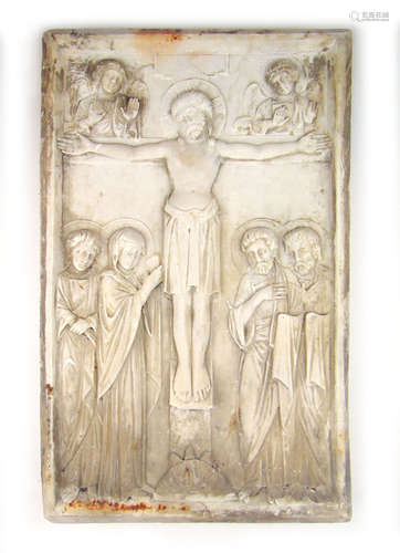 A 20th century carved marble panel of the crucifixion of Chr...