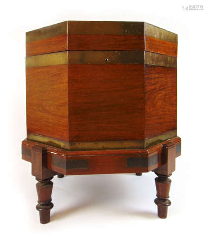 A 19th century rosewood and brass banded octagonal cellarett...