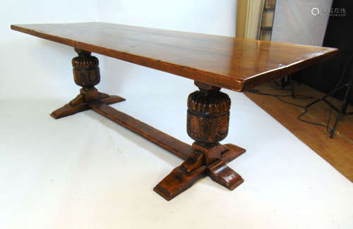 A reproduction 17th century style oak dining table,