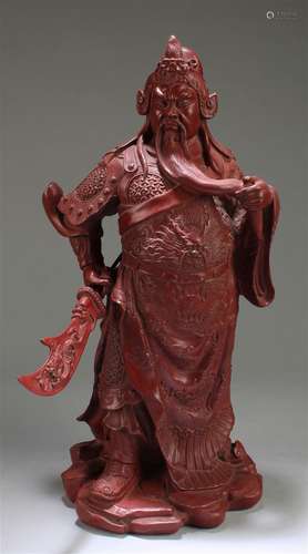 A Chinese Cinnabar Lacquer Guanyu Statue