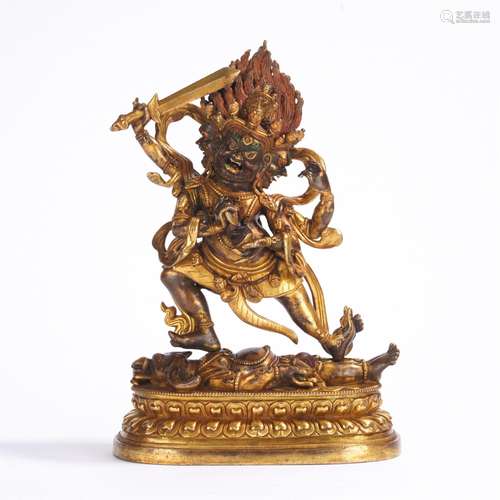 A GILT-BRONZE FIGURE OF MAHAKALA