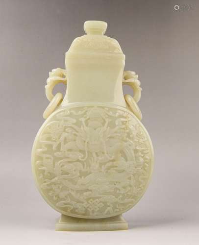 A CARVED WHITE JADE VASE AND COVER