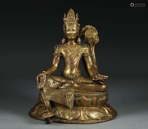 A GILT-BRONZE FIGURE OF GUANYIN