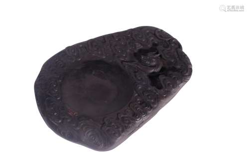 A CARVED DUANINK STONE