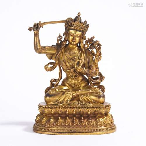 A GILT-BRONZE FIGURE OF MANJUSHRI