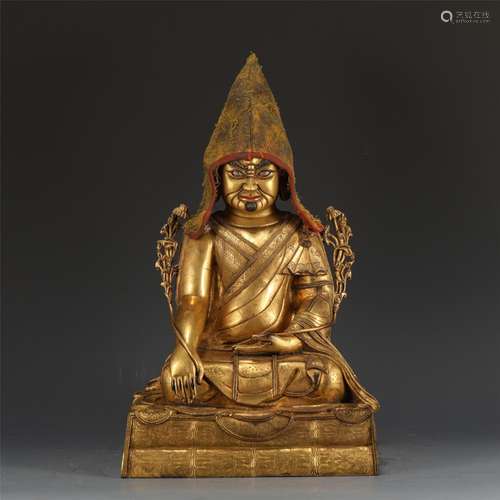 A GILT-BRONZE FIGURE OF GURU.QING PERIOD