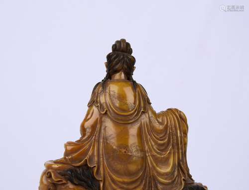 A CARVED SOAPSTONE GUANYIN